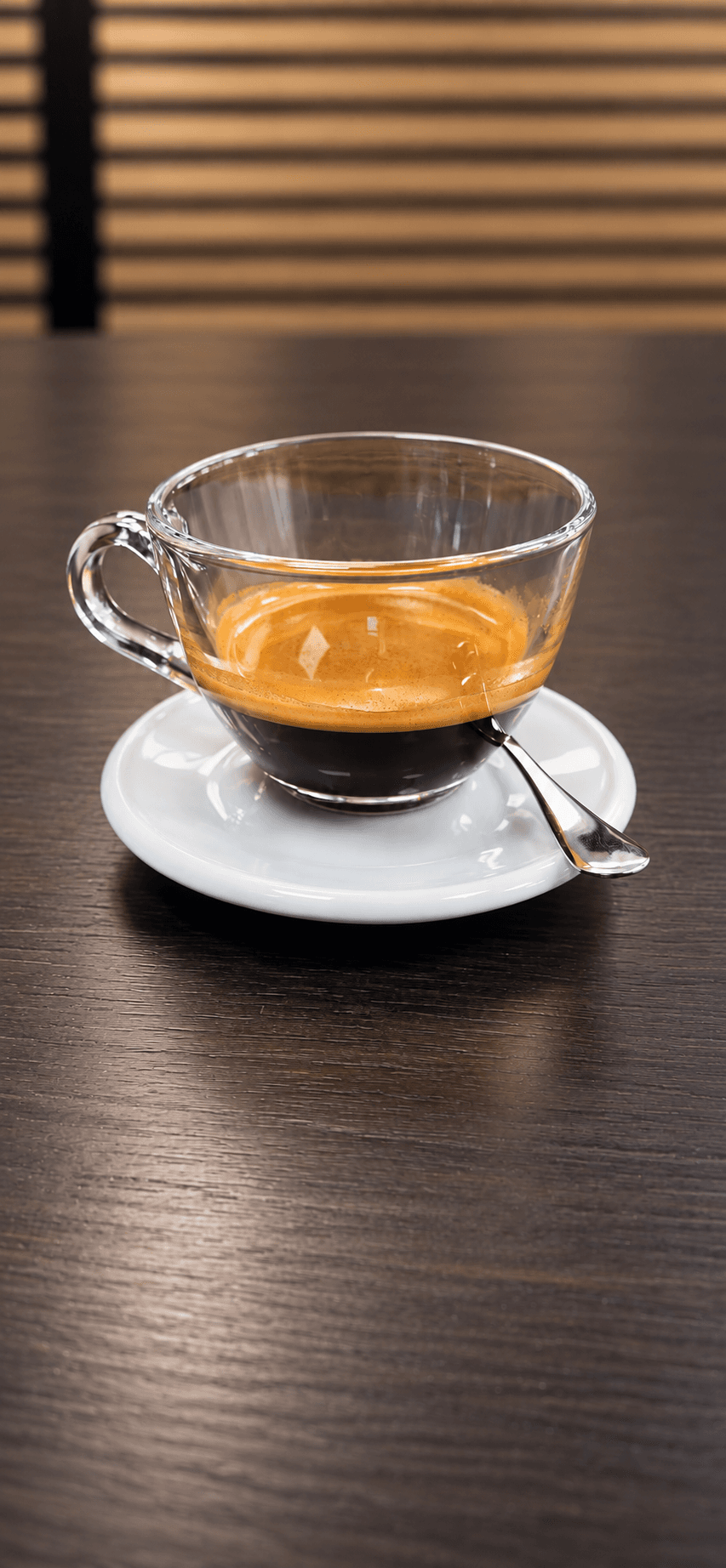 Double espresso in a glass cup